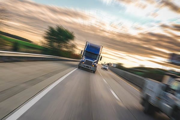 photo: 18-wheeler driving down the highway